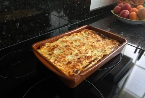 High angle shot of a pie in a rectangular tray taken out of the oven 스톡 사진