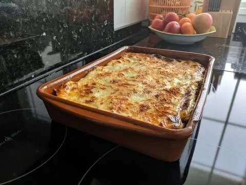 High angle shot of a pie in a rectangular tray taken out of the oven 스톡 사진