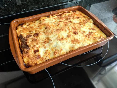 High angle shot of a pie in a rectangular tray taken out of the oven Stock Photos