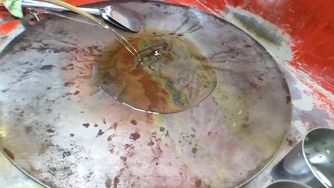 High angle shot. Pouring coconut oil in a hot frying pan. Slow motion. Stock Footage 276230021