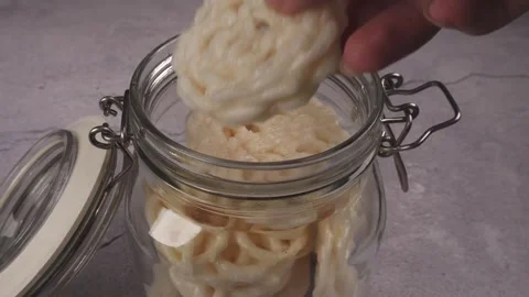 High angle shot of putting crackers into jar Stock Footage 277782841