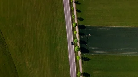 High angle shot of quiet country road connecting small towns in Germany Stock-Footage 336337644
