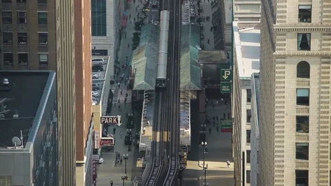 High angle shot of railway station amidst city buildings in Chicago Stock Footage 97101243