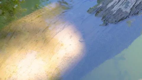 A high angle shot of a reflective lake surface Stock Footage 139462185
