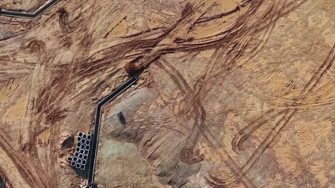 High-angle shot reveals a dry construction area with dirt paths 스톡 동영상 344954181