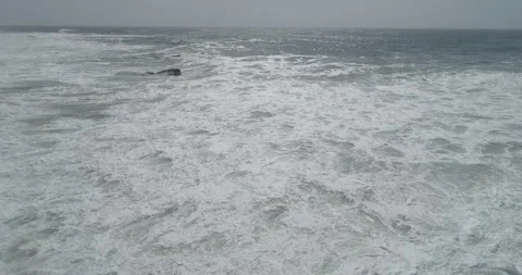 High angle shot of a rough and energetic ocean showing the raw power of natur Stock Footage 336926905