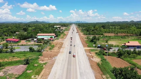 High angle shot rural road traffic. Cinematic shot of a car driving high speed o Stock Footage 236928762