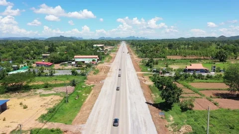 High angle shot rural road traffic. Cinematic shot of a car driving high speed o Stock Footage 236928764
