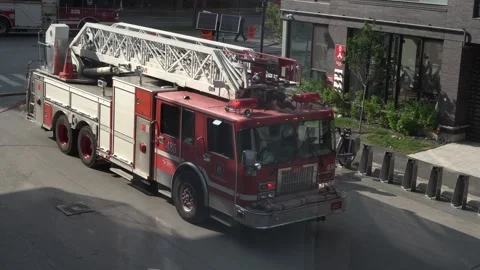 A high angle shot shows a red fire truck 스톡 동영상 335300733