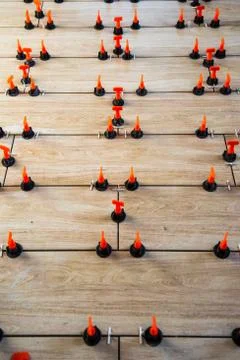 A high angle shot of small orange and black objects arranged in a pattern on  Foto stock