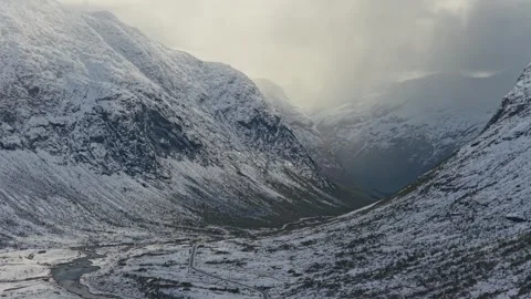 High angle shot of snowy mountain road during winter in Norway Stock Footage 320951192