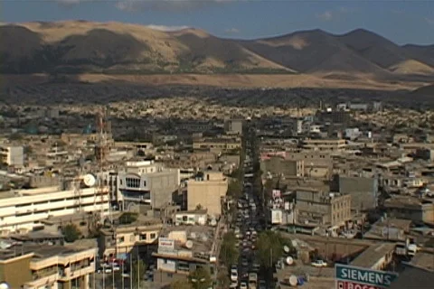 High angle shot of Sulimaniyah rooftops and distant desert and mountains. Stock Footage 86753574