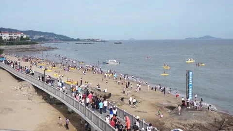 High Angle Shot, Tourist Walking at Beach near Hulishan Fortress, Xiamen, China Stock Footage 90072865