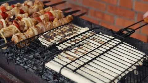 High angle shot of traditional meat kebabs on open fire grill Stock Footage 343385520