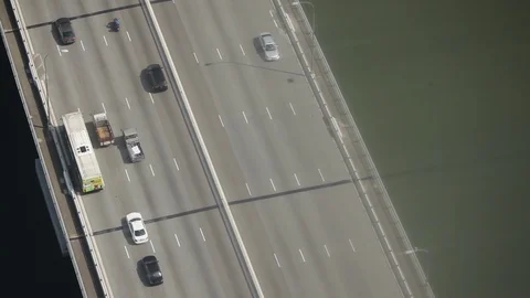 High angle shot of traffic on a bridge over a river Stock Footage 97103141