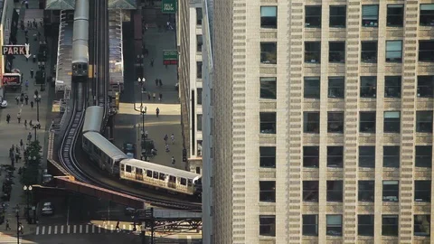 High angle shot of a train approaching a railway station in Chicago Stock Footage 97101274