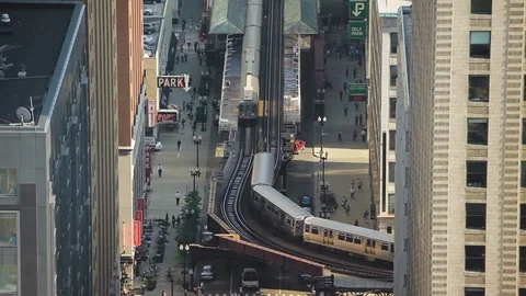 High angle shot of a train approaching a railway station in Chicago Stock Footage 97101598