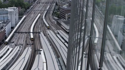High angle shot of trains pulling into London station Stock Footage 251469411
