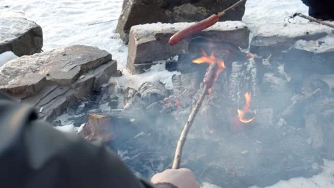 High angle shot two guys grilling hot dogs outdoors Stock Footage 233546510