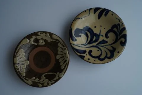 High angle shot of two plates with beautiful floral patterns on grey backgrou Stock Photos