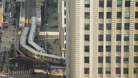 High angle shot of two trains passing each other in Chicago Stock Footage 97101299