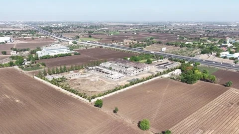 High Angle Shot of Under Construction Commercial Complex Project in Open Green Stock Footage 340383395