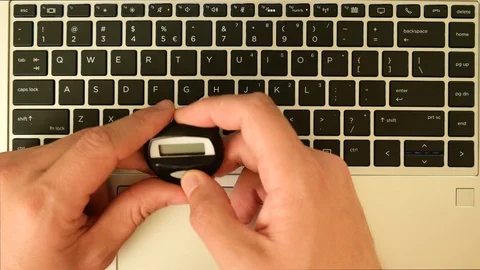 High angle shot using two factor authentication on a computer for secure Stock-Footage 104963493