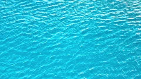 High angle shot of vibrant blue water with gentle ripples Vídeos de archivo 335043219