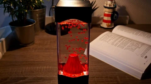 High angle shot of volcano lava lamp on table Stock Footage 111742895