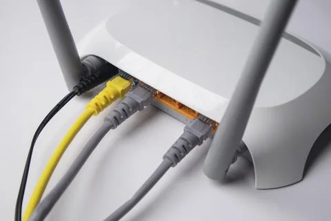 High-angle, side view of a white wireless router back panel showing a black.. Stock Photos