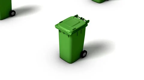 High angle up from single Trash Can revealing many (Green) Stock Footage 33605458