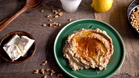 High angle slide to the right of middle eastern food spread with hummus, Stock Footage 121334608