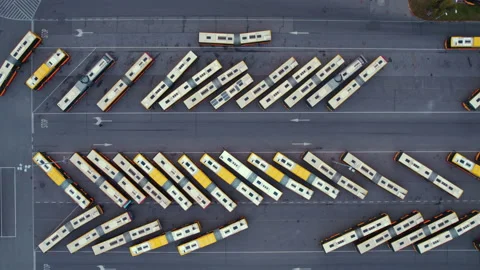 High angle slow motion drone shot of parked busses in the area of bus depot Stock Footage 221373614