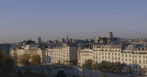 High angle slow motion shot of Paris skyline in afternoon with buildings, bridge Stock Footage 169609717