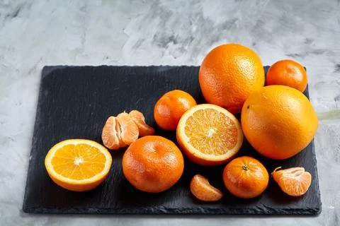 High angle still life view of sliced ruby orange and tangerine arranged together 写真素材