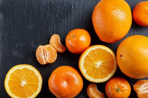 High angle still life view of sliced ruby orange and tangerine arranged together 写真素材