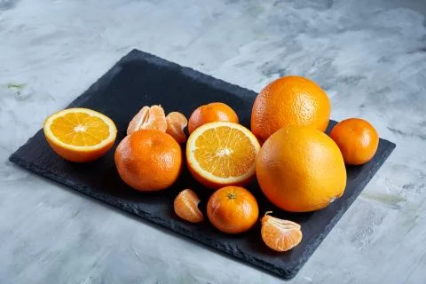 High angle still life view of sliced ruby orange and tangerine arranged together 写真素材