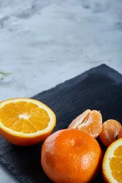 High angle still life view of sliced ruby orange and tangerine arranged together 写真素材