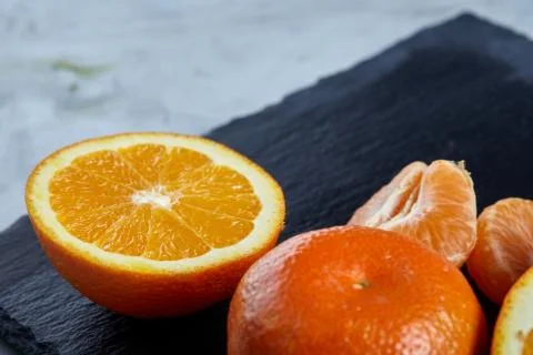 High angle still life view of sliced ruby orange and tangerine arranged together 写真素材