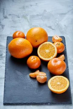 High angle still life view of sliced ruby orange and tangerine arranged together 写真素材