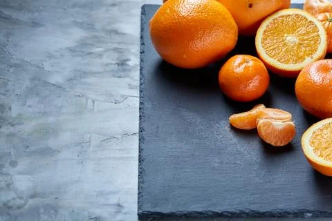 High angle still life view of sliced ruby orange and tangerine arranged together 写真素材