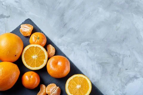 High angle still life view of sliced ruby orange and tangerine arranged together 写真素材