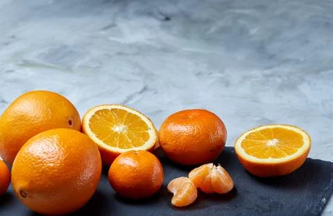 High angle still life view of sliced ruby orange and tangerine arranged together 写真素材