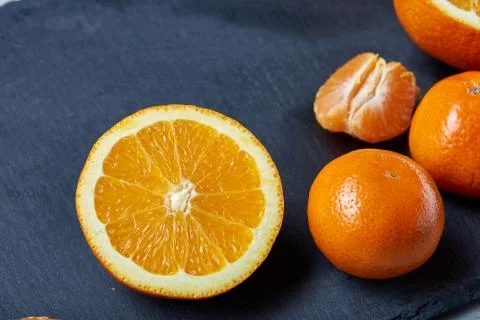 High angle still life view of sliced ruby orange and tangerine arranged together 写真素材