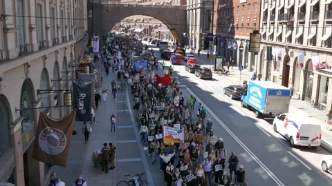 High angle Stockholm climate march fills city street, with protest signs Stock Footage 320743925