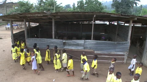 HIGH ANGLE:  STUDENTS MARCHING INTO AN OUTDOOR CLASSROOM IN GHANA Stock Footage 60115346