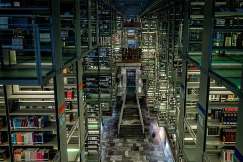 High angle symmetrical view of the central aisle and suspended book stacks at th Stock Photos