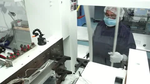 High angle of Technician Starting machine in Cleanroom Stock Footage 10895759