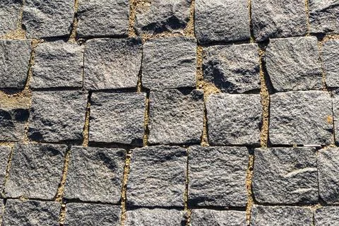 High angle texture background of square granite cobblestone pavement blocks.. Stock Photos