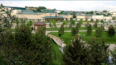High angle tilt down of the Saint Daniel complex park in Samarkand Stock Footage 336454118